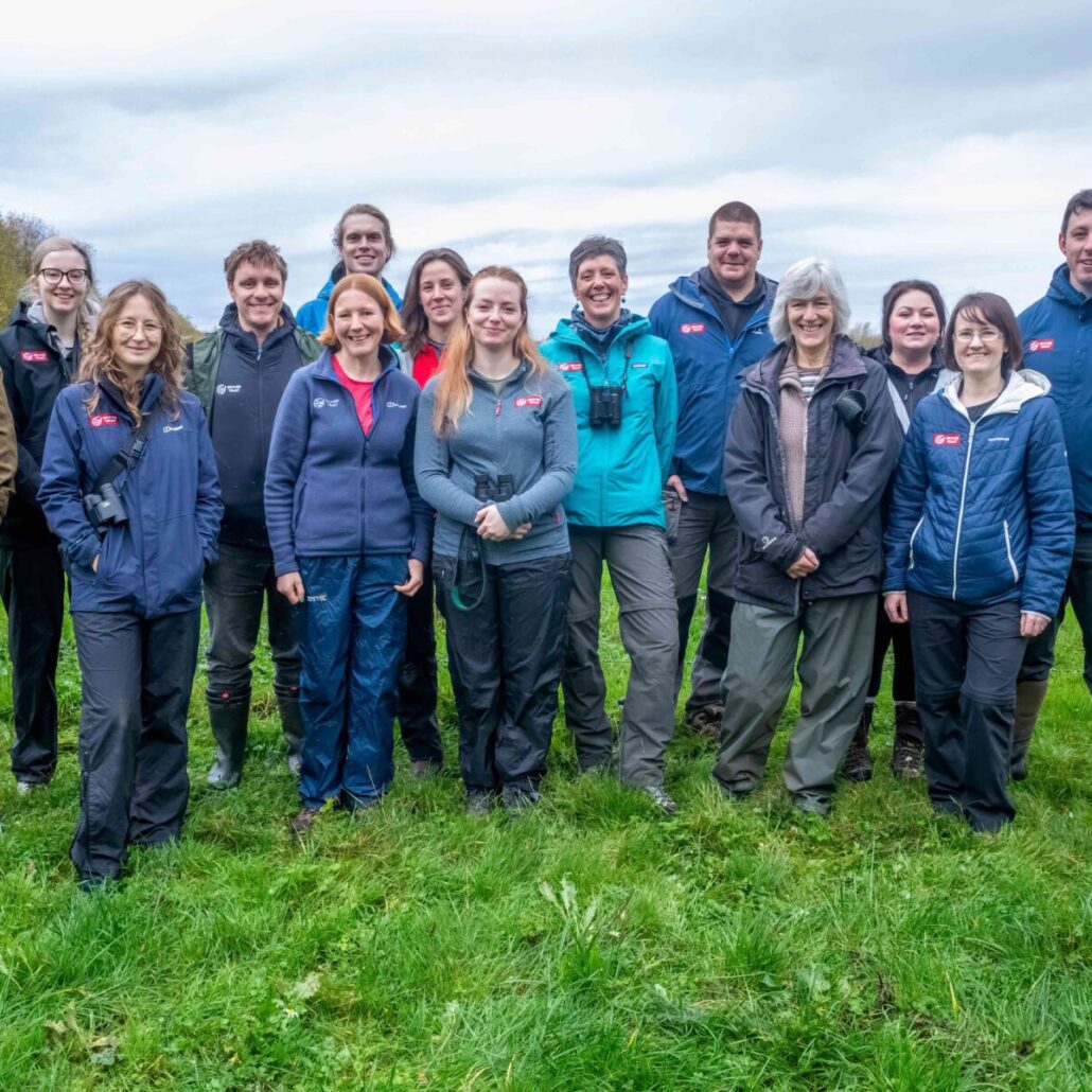 Beaver Trust team in a field, smiling at the camera