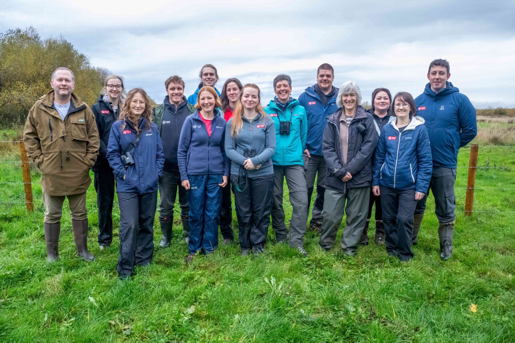 Beaver Trust team in a field, smiling at the camera