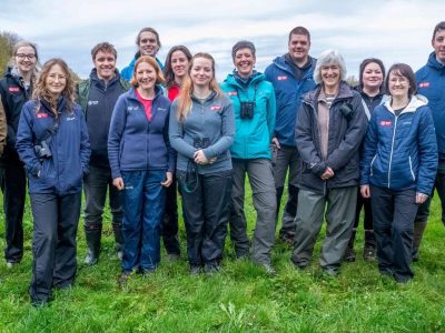 Beaver Trust team in a field, smiling at the camera